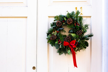 Wreath decoration on a front door for Christmas holiday