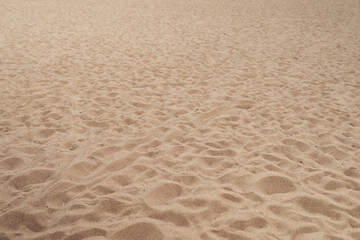 Sand beach background with footsteps