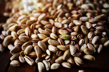 Roasted salted pistachios. Dried pistachios in small sack on  table.