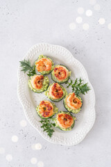 Cucumber Avocado Shrimp Appetizer. Canape with prawn, cucumber and guacamole, party food, finger food