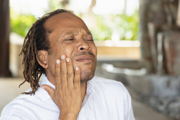Sick middle age African black man with toothache, tooth decay, oral sickness issue