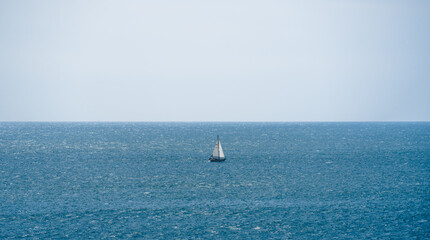 Lonely sailboat yacht in the ocean