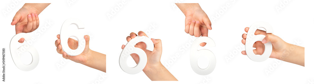 Poster number six in hand isolated on black background. number 6 in a child's hand holding on a black backg