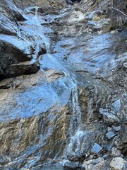 Fototapeta na wymiar Nameless waterfalls and cascades in the Calfeisental valley and in the UNESCO World Heritage Tectonic Arena Sardona (UNESCO-Welterbe Tektonikarena Sardona), Vättis - Switzerland (Schweiz)