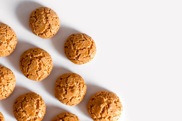 homemade cookies with cracks on a light background pattern copy space