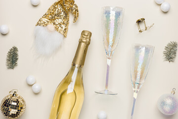 White sparkling wine bottle decorated hat of dwarf with golden sequins, crystal wine glasses,...