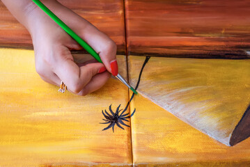 Painter at work on canvas