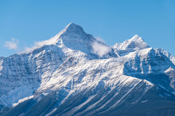 Panoramic view over hills withsnow on the mountains in Canadian Rockies