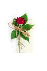 Set of wrapping paper and flowers for handmade on white isolated background. Homemade craft box gifts with  bouquet of red roses.