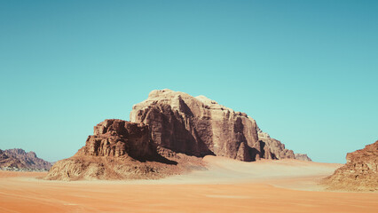 Wadi Rum, Jordan. A beautiful vibrant blue and orange sunset, Arabian desert, a dystopian martian landscape with unique rock formations and dunes. Backdrop for graphic resource or copy space no people