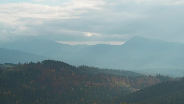 Panoramic view of the highest mountains in Ukraine - Hoverla and Petros, Chornohora mountain range. View from Bukovel - village and largest ski resort in Carpathian Mountains