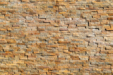 Decorative stone wall background pattern. Brown modern seamless brick wall luxury texture