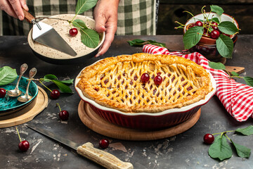 American homemade cherry pie, Female hands holding whole homemade cherry pie, banner, menu, recipe place for text, top view