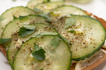 fresh toasts with cream cheese and cucumbers for breakfast, healthy food, white background