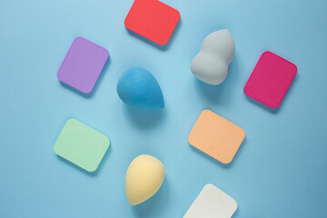 Top view of different cosmetics sponges,all types and forms.Good as cosmetic background.