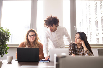 Group of young people working together in the office