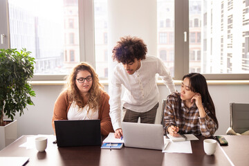 Group of young people working together in the office