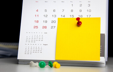 pin on calendar with post-it notes for writing. concept of appointment important date notification...