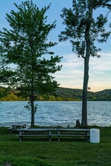 White plastic barrel for garbage in a park near Rockland Lake, New York. High-quality photo