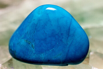 Lapis lazuli polished stone on a slab of fluorite crystal