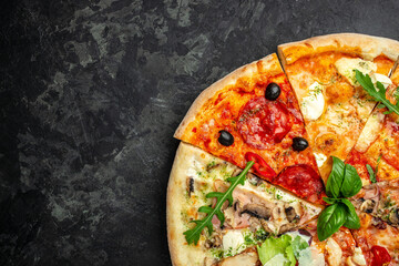 slices of pizza with different toppings, a hand holding a piece of pizza on a dark background,...