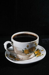 cup of coffee on black background