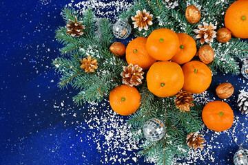 tangerines on a blue Christmas background free space