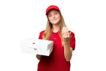 Young caucasian pizza delivery woman with work uniform picking up pizza boxes over isolated...