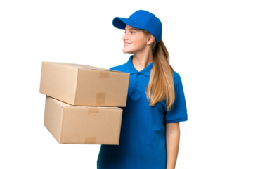 Delivery caucasian woman over isolated background looking to the side and smiling