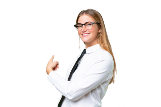 Young business caucasian woman over isolated background pointing back