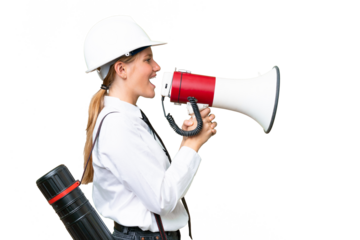 Young architect caucasian woman with helmet and holding blueprints over isolated background shouting through a megaphone