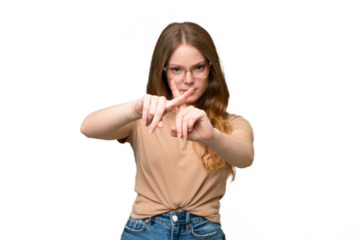 Young pretty woman over isolated background making stop gesture with her hand to stop an act