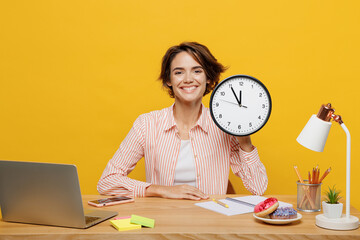 Young smiling happy successful employee business woman in casual shirt sit work at office desk with...