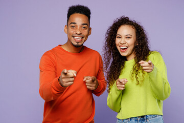 Young fun couple two friends family man woman of African American ethnicity wear casual clothes...