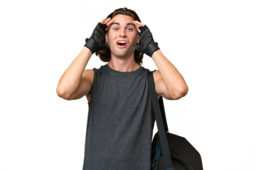 Young sport handsome man isolated on green chroma background with surprise expression