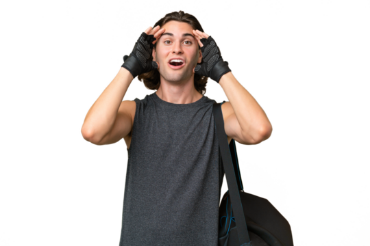 Young sport handsome man isolated on green chroma background with surprise expression