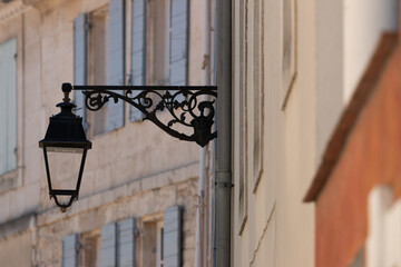 Black metal ornament. Houses in the city of Arles, Mediterranean region, France.