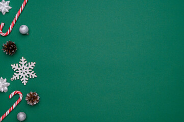Christmas, winter layout on a green background. Concept of christmas, winter, new year. Flat lay, top view. Copy space.