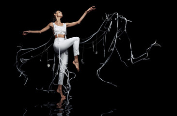 Woman dancing on water with white flowing ribbons
