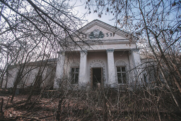 Fototapeta na wymiar Abandoned rural school near the city of Pripyat, Chernobyl region, exclusion zone, Ukraine