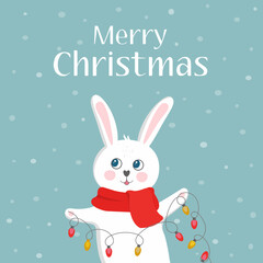 Merry christmas greetings from cute white bunny in red scarf with garland light on a blue background witn snowflakes