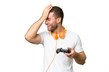 Young handsome man playing with a video game controller isolated on green chroma background has realized something and intending the solution