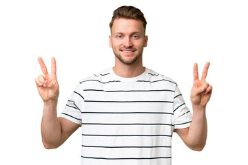 Fototapeta premium Young blonde caucasian man over isolated background showing victory sign with both hands