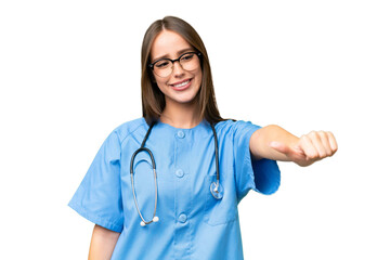 Young nurse caucasian woman over isolated background giving a thumbs up gesture