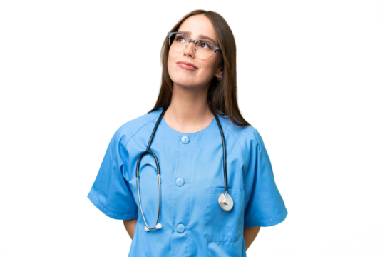 Young nurse caucasian woman over isolated background and looking up