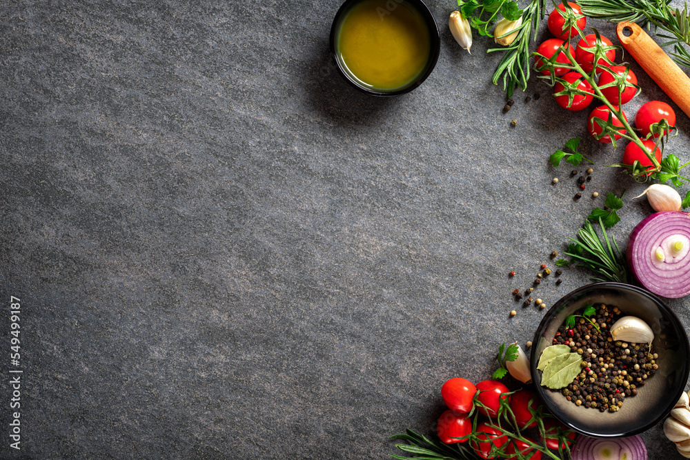 Poster culinary concept. dark cooking food background vegetables and spices on the kitchen table with copy 