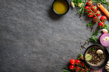 Culinary concept. Dark cooking food background Vegetables and spices on the kitchen table with copy...