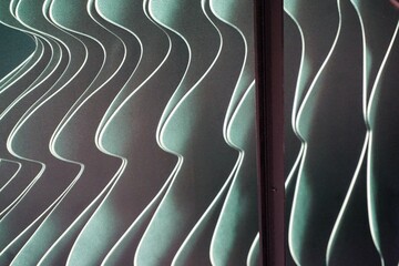 Grüngrau-weißer Hintergrund mit Wellenmuster