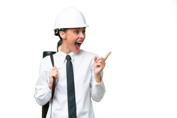 Young architect woman with helmet and holding blueprints over isolated background intending to realizes the solution while lifting a finger up