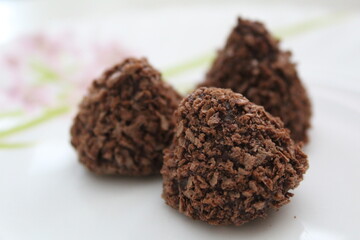 chocolate truffles on a white plate